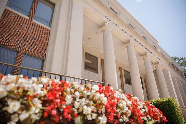 Flowers bloom in front of Rose Administration Building